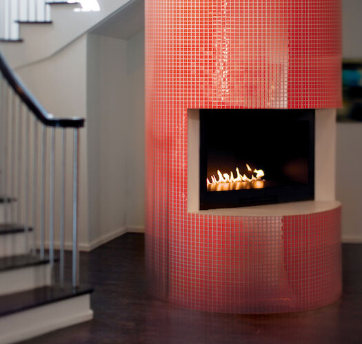 red glass tile on fireplace surround