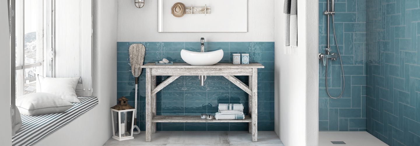 Beautiful coastal style bathroom with blue tiles