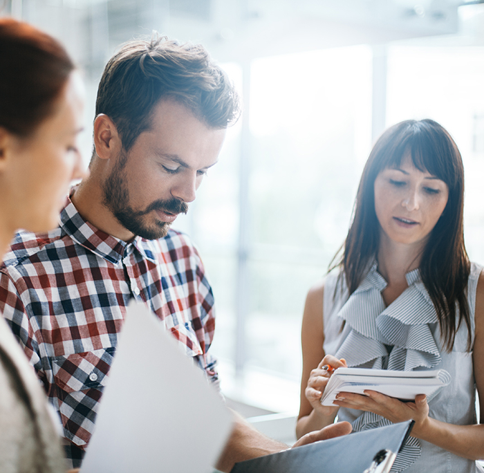Young architects working on project in office